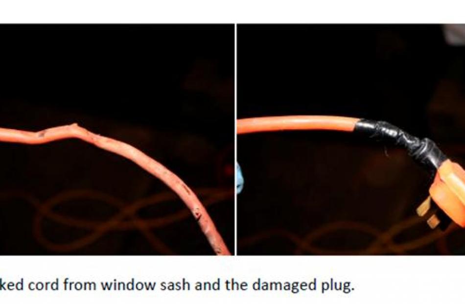 The extension cord damaged by a window sash and used to charge the mobility scooter.