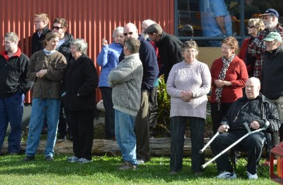 Onlookers watch the launch of the restored ferry yesterday.