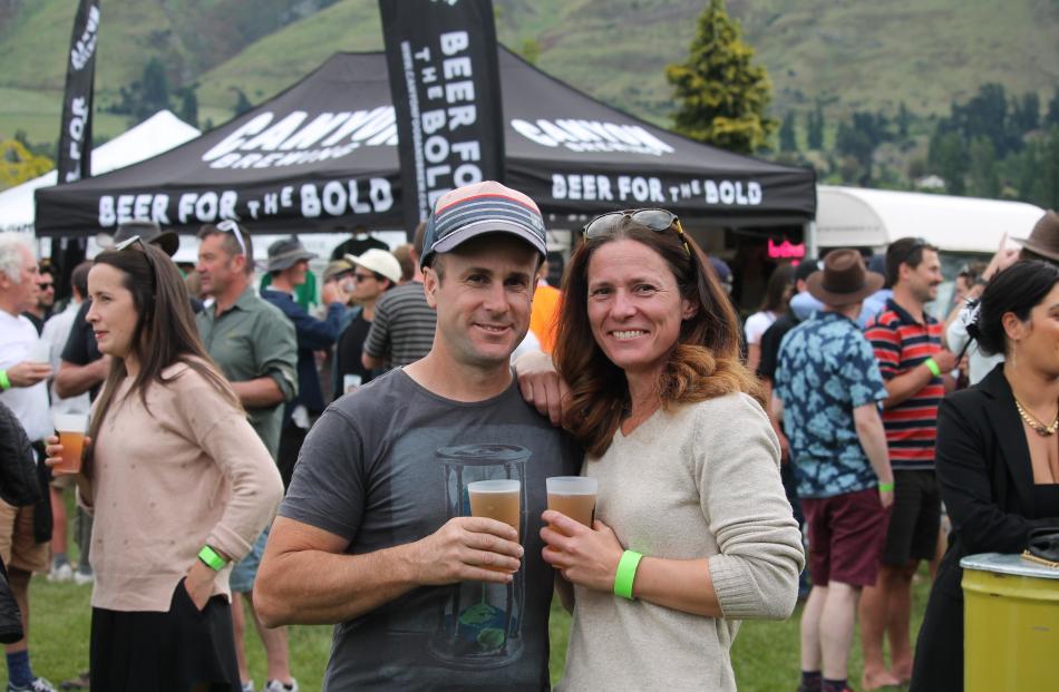 After photobombing, (from left) Craig and Saskia Guy enjoy a moment together.