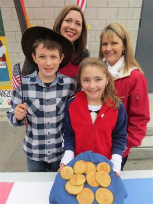 Americans (from left) Ethan Ratcliff (12) and Tina Ratcliff, with Jamie Coyle (11) and Andrea...