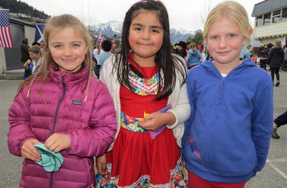 Pupils (from left) Jessa Boden (7), representing New Zealand, Isadora Figueroa (8), representing...