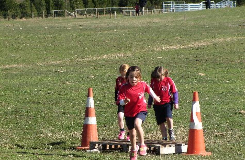 Milly McAtamney (5) races away from the ''bridge'', followed by Phoebe Harrex (left, 5) and...