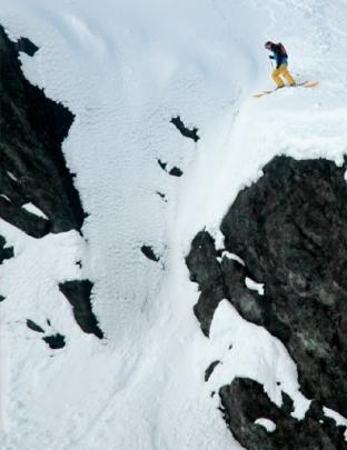 Wanaka professional skier Sam Smoothy surveys a chute before allowing gravity - and his skills -...