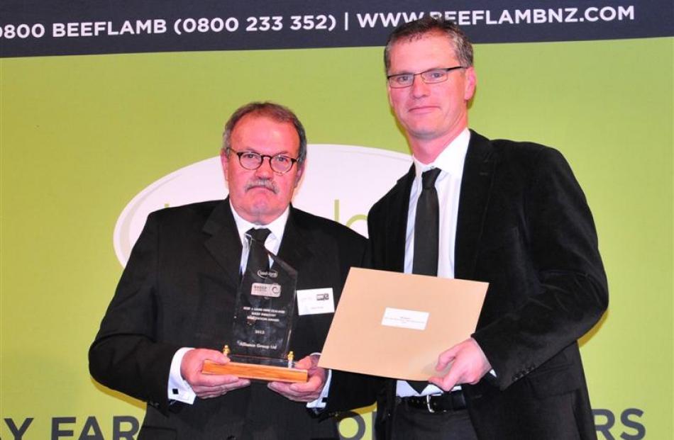 Alliance Group chairman Owen Poole (left) accepts the Beef and Lamb New Zealand sheep industry...