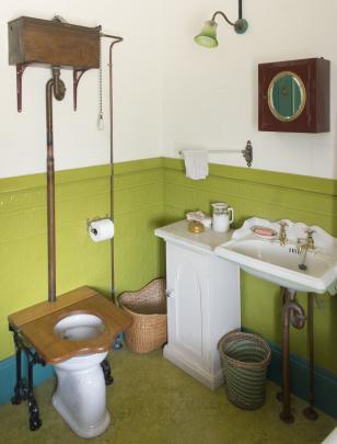 The cottage did not have a bathroom until the owners created this one using fittings from...