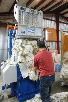 Wool is pressed into bales ready for shipment and sale. Photos by Ruth Grundy.