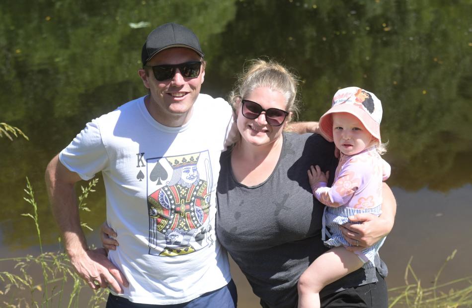 William and Libby Shepherd, of Dunedin, along with daughter Millie (2) enjoy the sunshine.