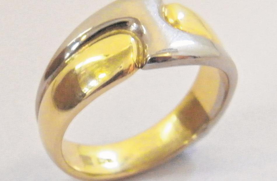 An 18ct yellow and white gold ``lightning flash'' ring by Tony Williams, which is popular as a...