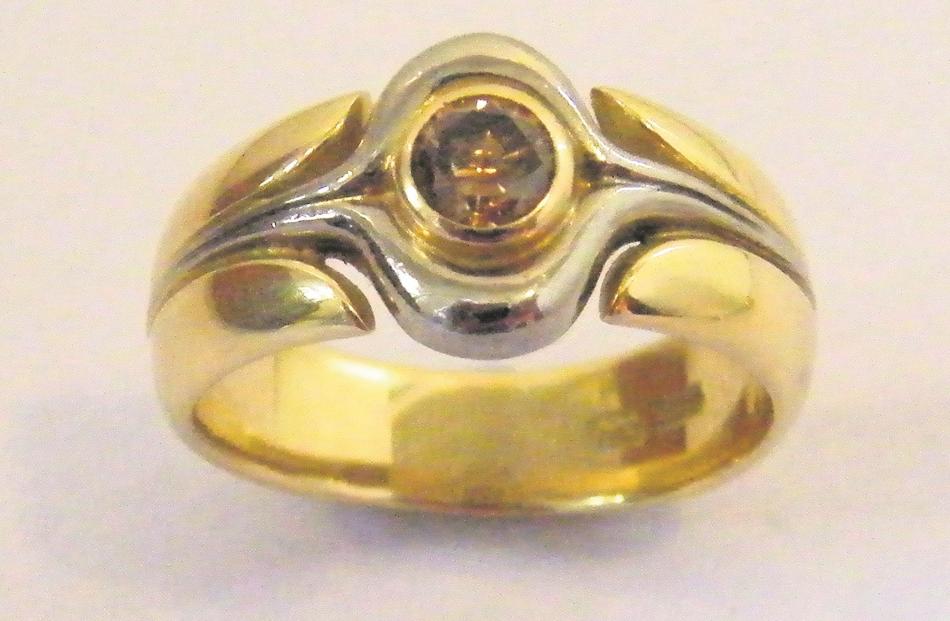 An 18ct yellow and white gold ring with cognac diamond, designed as a man's ring by Tony Williams.