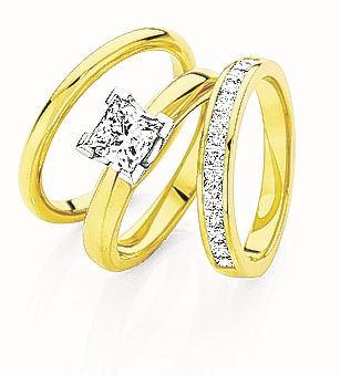 Canadian Fire princess cut diamond engagement, anniversary and wedding rings set at Daniels...