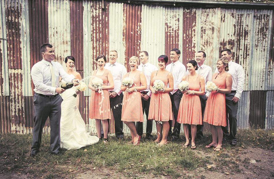 Jo and Sam Sharp, of Invercargill, pictured with their wedding party. They were married at...