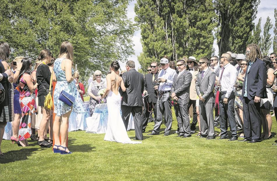 At the outdoor ceremony of Tania and Sam Jenkins in Wanaka last November.
ASPIRING PHOTOGRAPHY