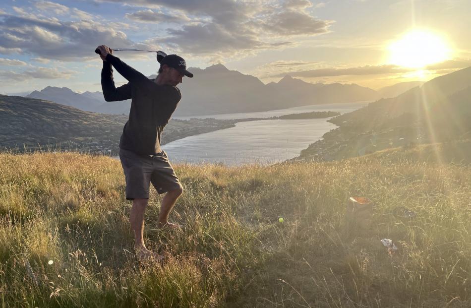 Bruce Grant of Grant’s Farm, Frankton, practises his golf swing on New Year’s Eve. PHOTO: ANNIKA...