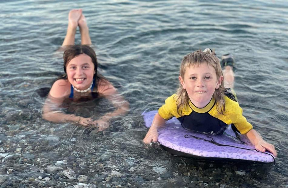 Krysta Stephen (11) and Carson Powick (7) take a 9pm dip in Lake Hawea on December 30. PHOTO: SAM...