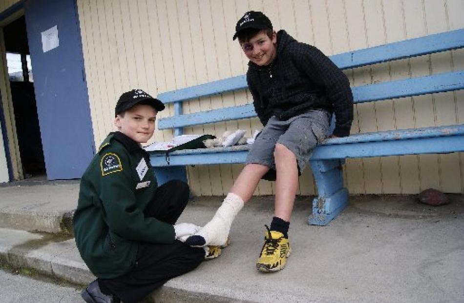 Max Swift (11), of Wanaka, tends to an ''injured'' Hunter Hewson (10), of Hawea. Alexandra