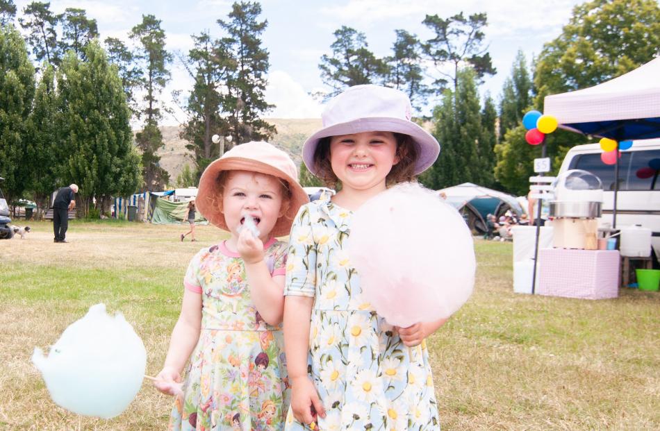 The Robinson sisters Daisy (2, left) and Luna (4), of Palmerston North, enjoy some candy floss at...