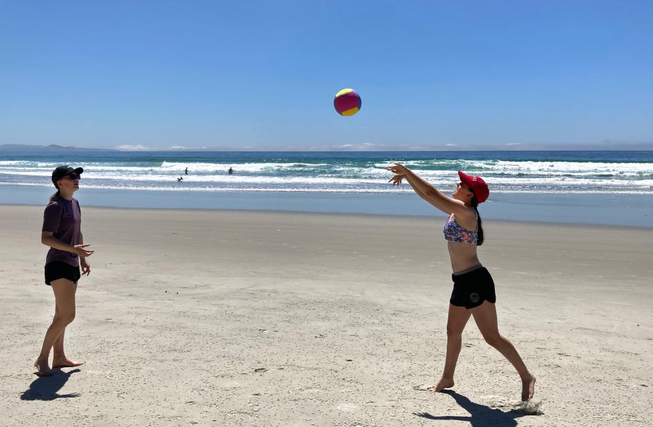 Annabel (16) and Isla (13) Ludgate play volleyball at Long Beach. PHOTO: JACKIE LUDGATE