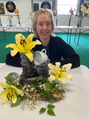 Liz Bremner, of Dunedin, is pictured with her best overall prize-winning floral art creation, on...