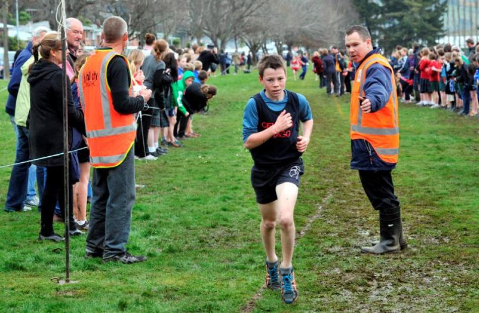 Charlie Marsh (12), of Millers Flat School, crosses the finish line to win the boys year 7 race.
