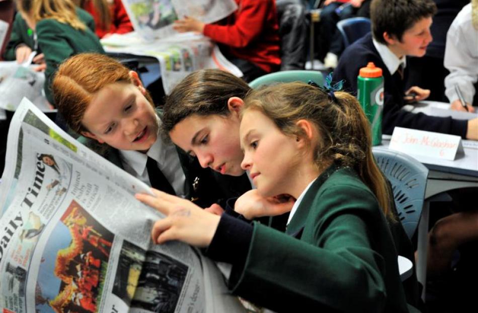 Columba College pupils (from left) Brielle Alliott (11), Galina Mandich (11) and Sophie Nelson ...