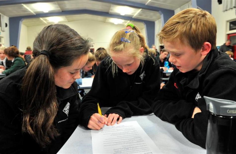Fairfield School pupils (from left) Erin Hartley, Kayla Potbury and Will Bathgate (all 11) write...