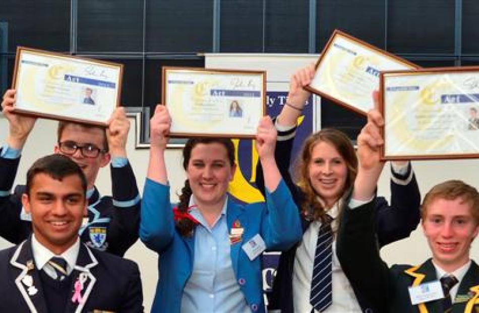 Holding their Class Act 2013 awards  for all to see are (from left) Columba College pupil Sian...