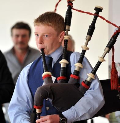 John McGlashan College piper Sam Darling pipes Prime Minister John Key into the 2013 Class Act...