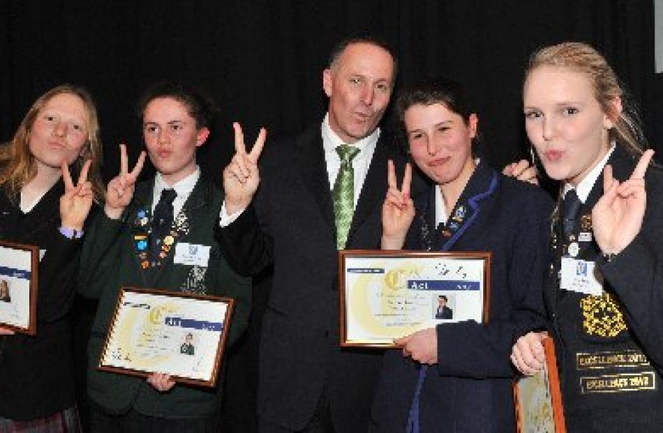 Posing for the camera with Prime Minister John Key (centre) are Class Act award winners (from...