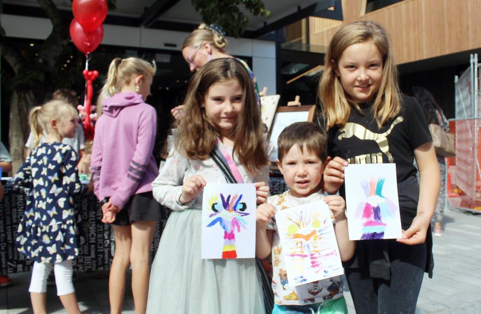 Erica (7), Aiden (4) and Alice (9) Mitchell, of Invercargill, painted an ostrich as a part of...