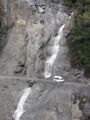 A camper van passes the Diana Falls slip  after a single lane  between Makarora and Haast was...