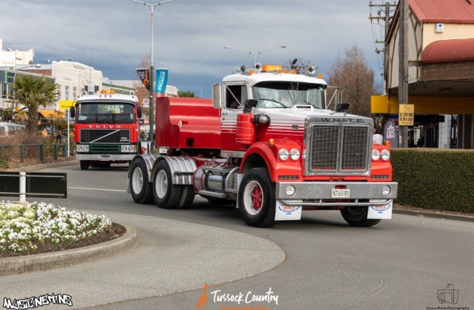 Big rigs parade down main street at the Gore Truck Show.