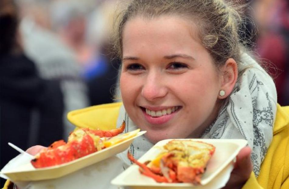 Katja Czieselsky (23) prepares to enjoy the crayfish on sale at the festival.
