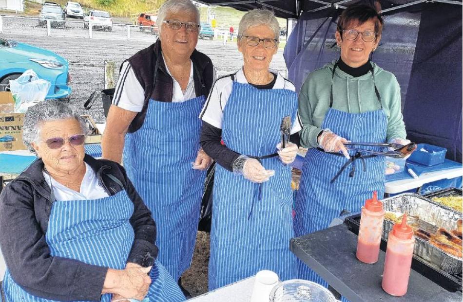 Sausage sizzle . . . Lions Club of Seaward Kaikoura members Doreen Tomlin (left), Rita Calvert,...