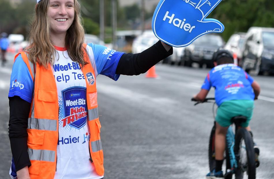 Paige Julian (19) shows her support for participants.