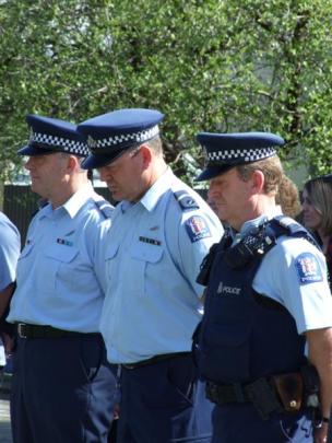 Among about 30 people at the Central Otago Police Remembrance Day service in Alexandra yesterday...