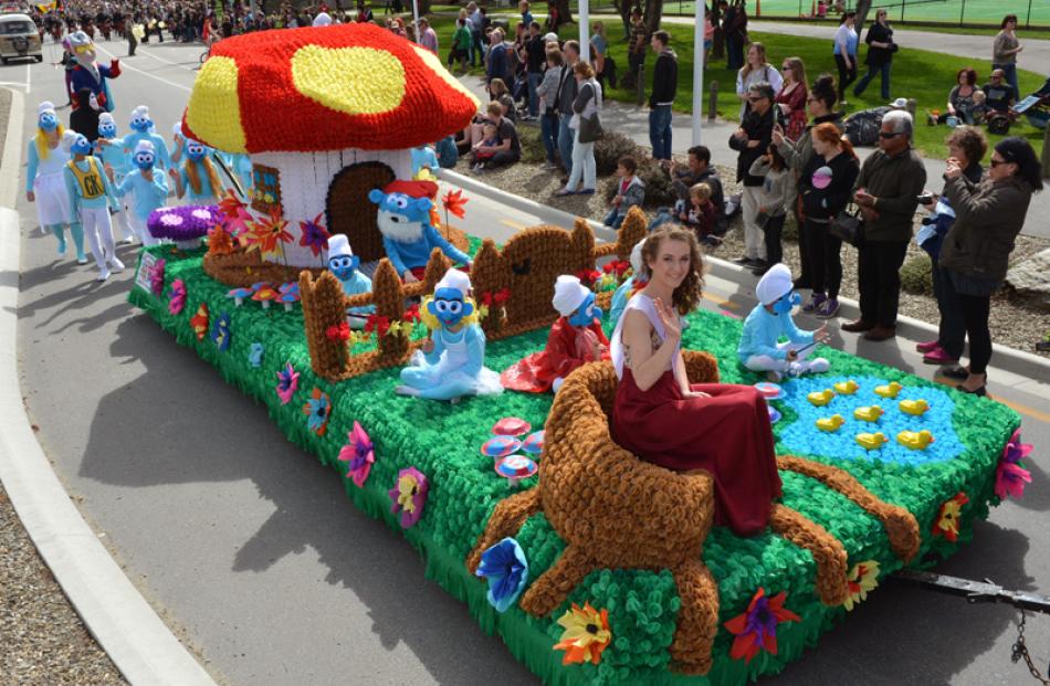 Festival princess Paloma Kelly on the smurf themed float of St Gerard's School.