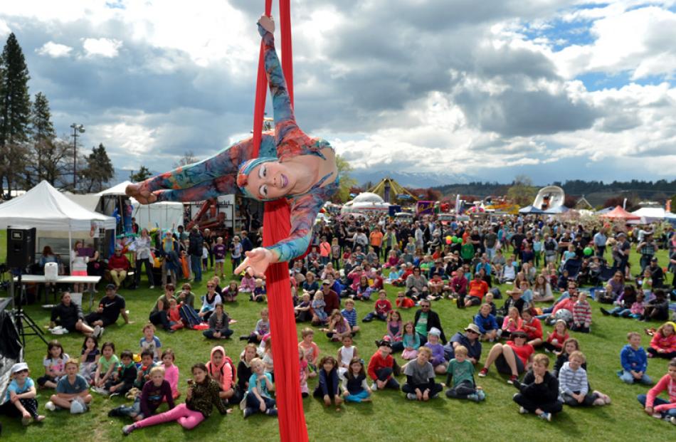 Jaine Mieka dazzles the crowd with her aerial act at Pioneer Park.