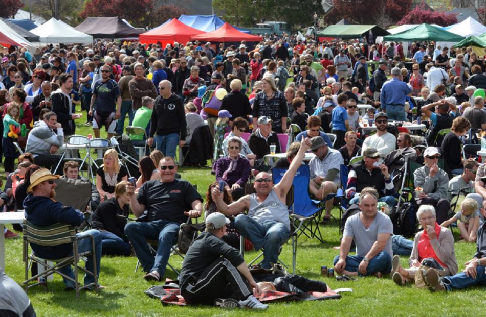 The crowd in Pioneer Park enjoys the entertainment.