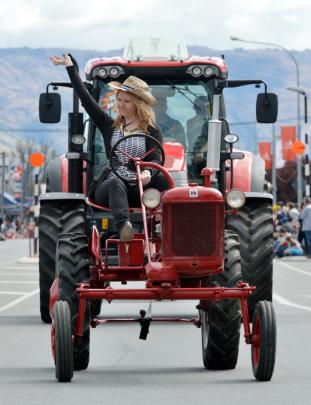 Tractor woman: Sheree Williams of Clyde on a 1951 Farmall, towing a new McCormick tractor (Murray...