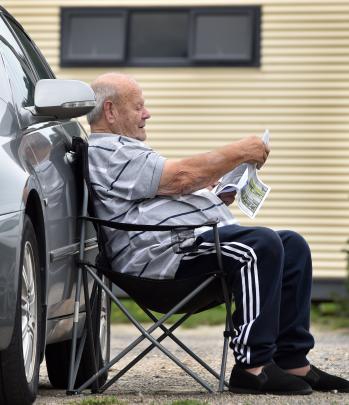 What are the odds? Owen Lawrence, of Invercargill, studies the race book.