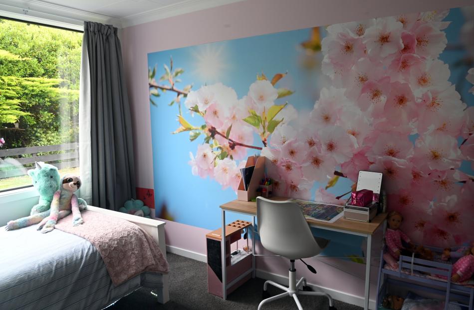 Ten-year-old Alice Porter chose the floral wallpaper mural for her bedroom. PHOTO: CRAIG BAXTER