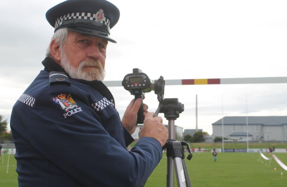 Senior Constable Colin Johansen tracks the speed of the children taking part in the event. The...