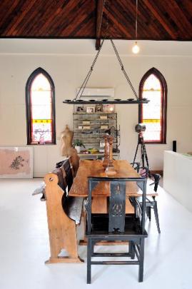 The furniture is a mix of old and new, rustic and industrial.