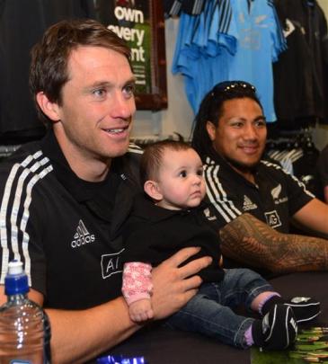 Ben Smith and Ma'a Nonu met 6-month-old fan Ashley Johns. Photo by Peter McIntosh.