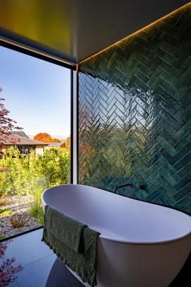 Emerald green tiles feature in the master en suite. PHOTO: SAMPFORD CATHIE