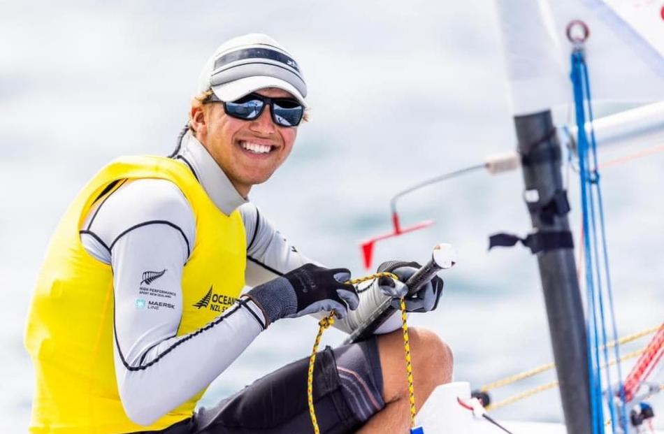 Zach Stibbe (Otago Boys’) celebrates after winning the youth boys title in the ILCA6 class at the...
