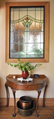 This side table was made by Dr Poole’s father. The leadlight was transported from Invercargill in...