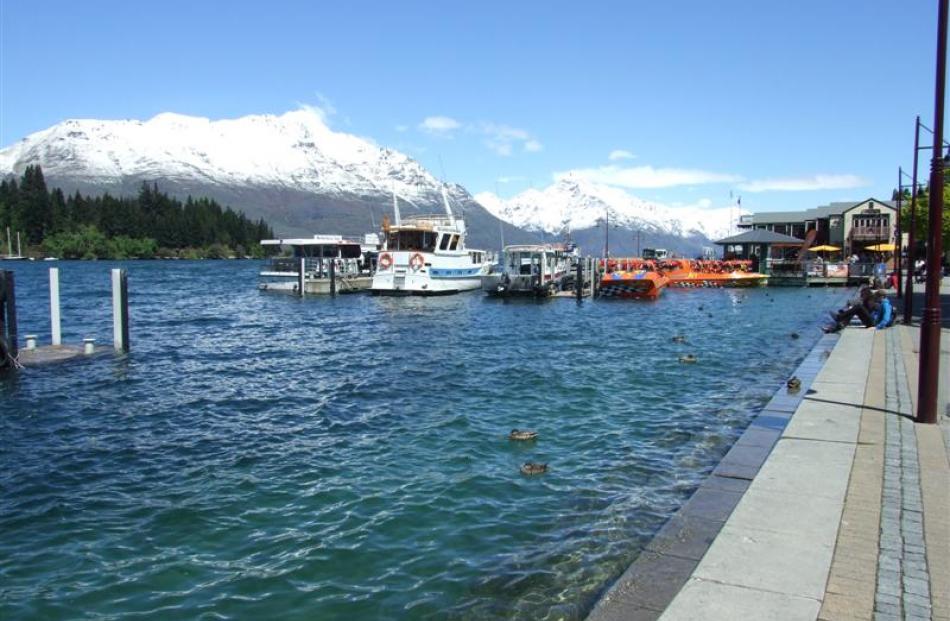 Lake Wakatipu yesterday afternoon, having claimed much of the foreshore and the steps near...