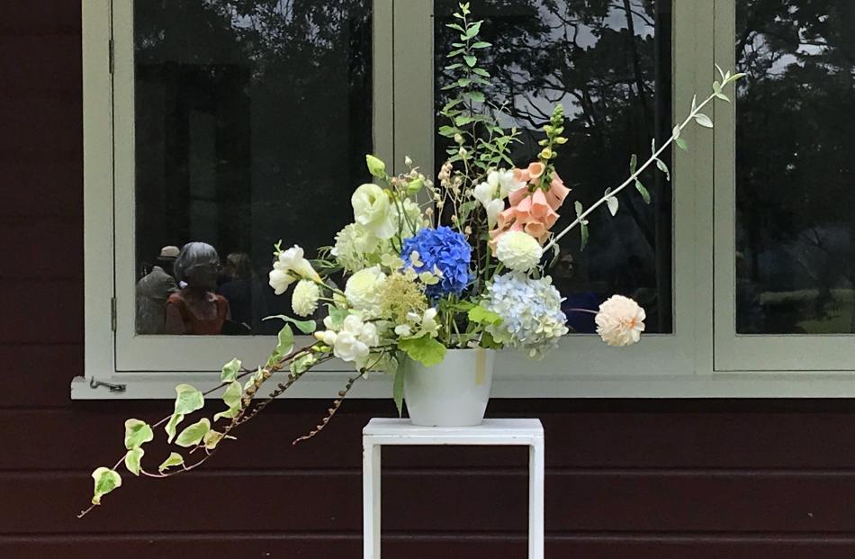 Dahlias were included in this arrangement at an outdoor wedding in February.