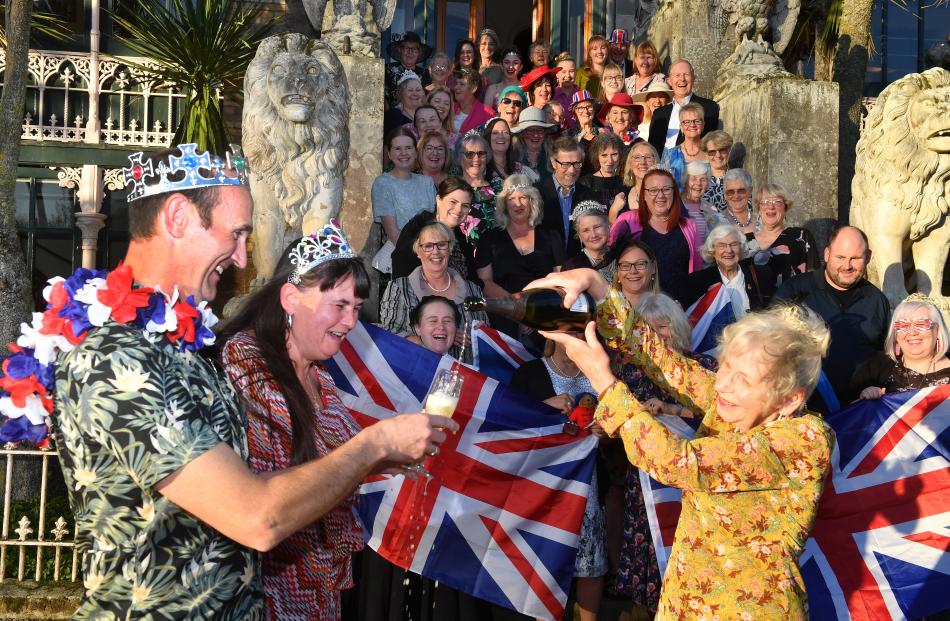 Larnach Castle owner Margaret Barker pours some bubbles for Liam and Jacqueline Sparrow during a...